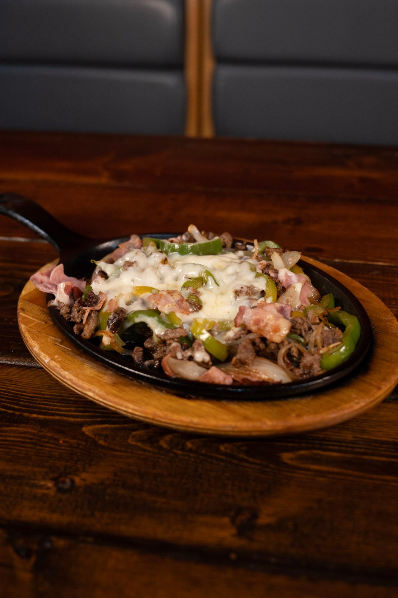 Sizzling cast-iron fajitas with steak and peppers